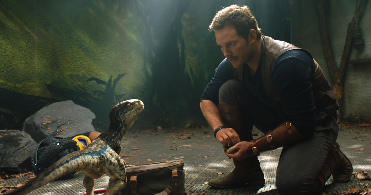 Owen (CHRIS PRATT) with a baby Velociraptor in "Jurassic World: Fallen Kingdom." When the island’s dormant volcano begins roaring to life, Owen and Claire (BRYCE DALLAS HOWARD) mount a campaign to rescue the remaining dinosaurs from this extinction-level event. Welcome to "Jurassic World: Fallen Kingdom." Universal Pictures 