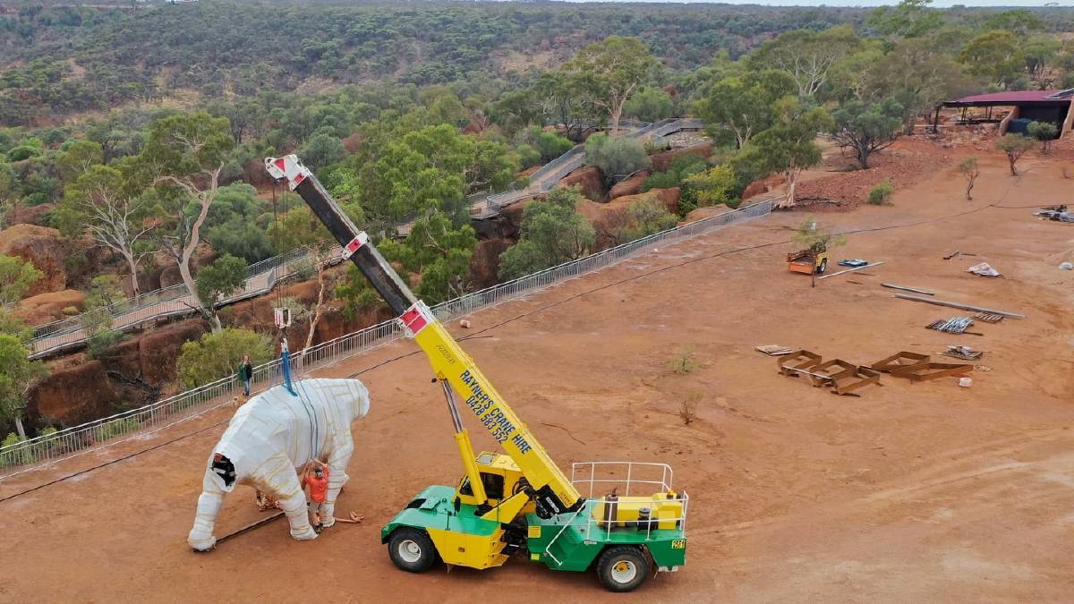  One of the dinosaurs being loaded into place. Photo: John Elliott.